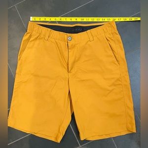 Under Armour Heat Gear Shorts, size 34, 10” inseam, Color is a mustard/camel.